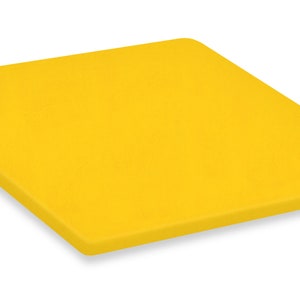 May include: A bright yellow cutting board made of plastic. The board is rectangular and has rounded corners.