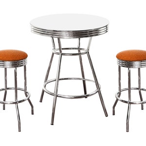 May include: A chrome diner table set with two orange upholstered stools. The table has a round, chrome top with a raised edge.