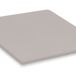 May include: A square, light gray cutting board with rounded edges. The surface has a subtle, textured pattern. The board is designed for food preparation and is suitable for various kitchen tasks.