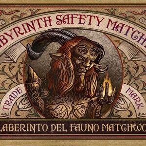 May include: Vintage-style matchbox label featuring a dark-haired, horned creature with glowing eyes, holding a lit match. The label reads "Labyrinth Safety Matches" and "El Laberinto del Fauno Matchworks".