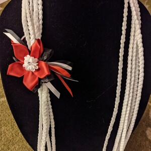 All 5 strands solid one color, bow and flower are other colors.

Please add in notes or message me.