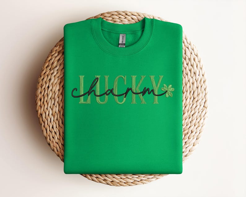 May include: Green sweatshirt with the text "LUCKY charm" in gold embroidery and a green shamrock.