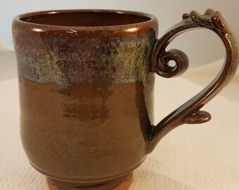 Cute coffee, tea, hot chocolate mug in celedon and brown glazes.