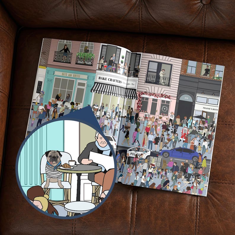 May include: An open book illustration depicting a bustling city street scene with shops, cafes, and people. A close-up shows a pug wearing a striped shirt sitting at a cafe table with a person. The book is open on a brown leather surface.