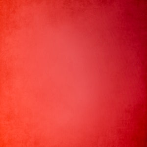 May include: A solid red background with a subtle gradient effect. The background is a deep red color that fades to a lighter red color in the center.