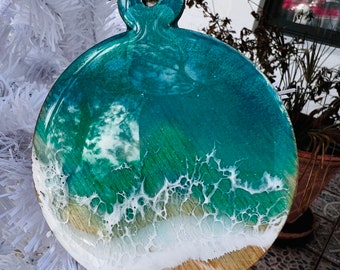 Ocean Wave Christmas tree Ornament 3.2 inches,1/8 inch thick. HandPainted resin on light birchwood. Comes with hemp twine.