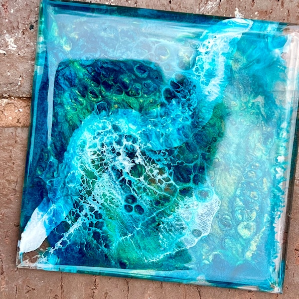 Aquamarine, blue, green, and white glass coaster/painting/trivet, or spoon rest. Resin painted wave with crests.