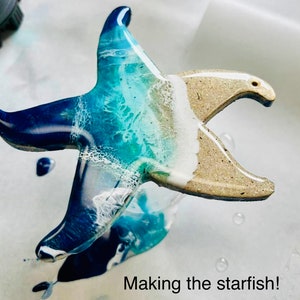 These resin painted ocean wave starfish are ready for your rear view car mirror, Christmas tree,  ocean themed wall, wedding,and/or nursery!