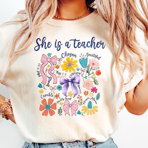 She Is Teacher T Shirt, Christian Teacher Mom Floral Shirt, Coquette Bow Teacher Shirt, Bible Verse Teacher Gift, Teacher Apparel