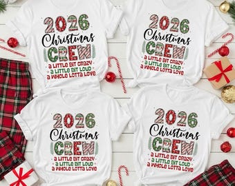 May include: Four white short-sleeve t-shirts featuring the text 2026 Christmas CREW, a little bit crazy, a little bit loud, a whole lotta love. The text is decorated with red and green patterns, surrounded by red and green holiday ornaments.