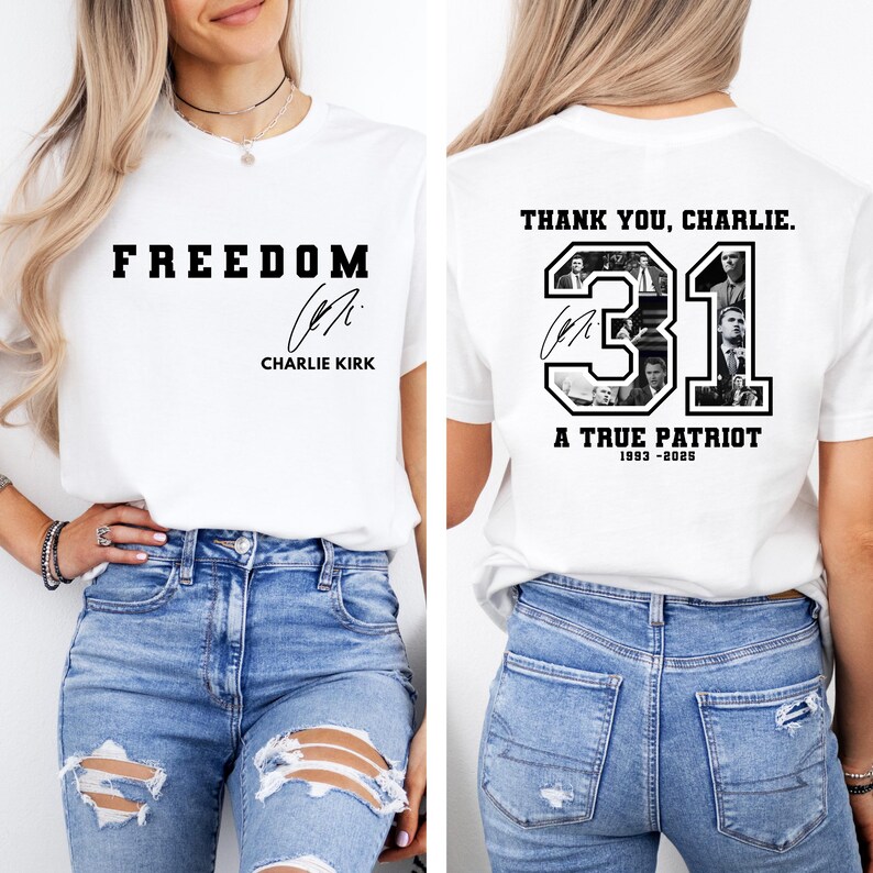 May include: White t-shirt with the word "FREEDOM" in bold black letters and a signature. The back of the shirt features the text "THANK YOU, CHARLIE." with the number "31" and the words "A TRUE PATRIOT 1993-2025".