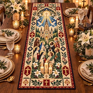 May include: A rectangular table runner featuring a detailed religious illustration of a cathedral, doves, and several figures with halos. The border displays red and gold crosses, green foliage, and white lilies on a cream background.