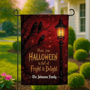 May include: A rectangular garden flag featuring a dark red background with a black tree silhouette, three black crows, and a glowing vintage street lamp. The text reads: Hope you HALLOWEEN is full of FRIGHT & DELIGHT and The Johnsons Family.