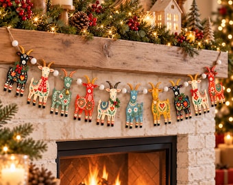 May include: A decorative garland featuring ten colorful, folk-art style goat ornaments strung together with white pom-poms. Each goat figure displays unique floral and geometric patterns in shades of red, blue, green, yellow, and black.