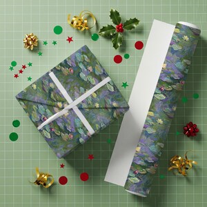 May include: A wrapped gift and a roll of wrapping paper with a water lily design. The gift is tied with white ribbon. The background is a light green grid with scattered gold bows, red stars, and green circles.