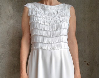 white dress with fringe bottom