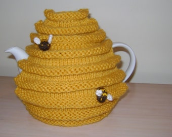 Hand knitted tea cosy, skep, bee hive, teapot cosy, decorated with knitted bees. A gift for all occasions.