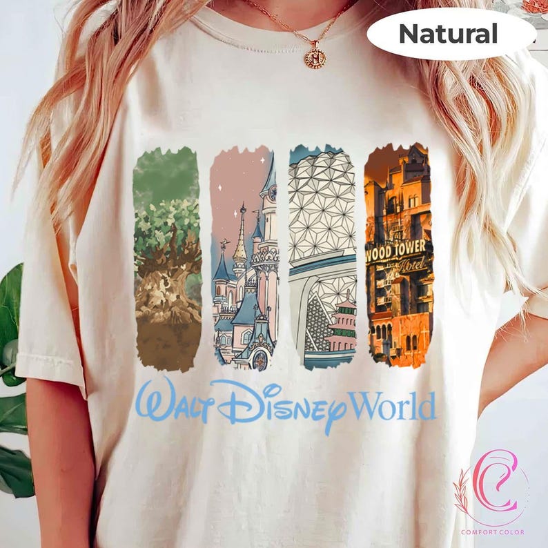 May include: Cream-colored t-shirt featuring four vertical rectangular illustrations of Disney World landmarks. The shirt has the words "Walt Disney World" in light blue script. The word "Natural" is printed at the top.