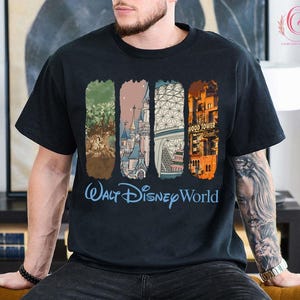 May include: Black t-shirt featuring a colorful graphic of Walt Disney World landmarks. The design includes images of the Tree of Life, Cinderella Castle, Spaceship Earth, and the Hollywood Tower Hotel. The words "Walt Disney World" are written in blue.