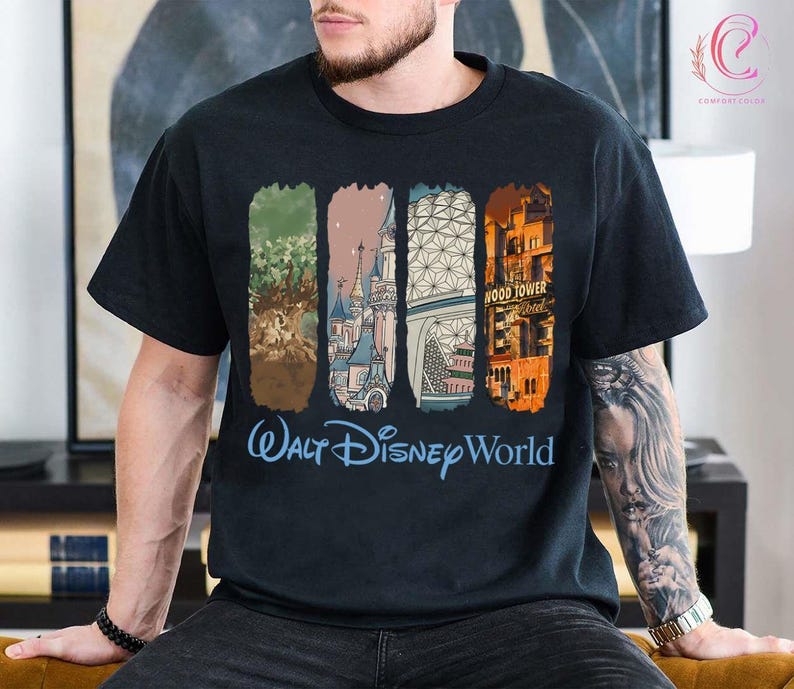 May include: Black t-shirt featuring a colorful graphic of Walt Disney World landmarks. The design includes images of the Tree of Life, Cinderella Castle, Spaceship Earth, and the Hollywood Tower Hotel. The words "Walt Disney World" are written in blue.