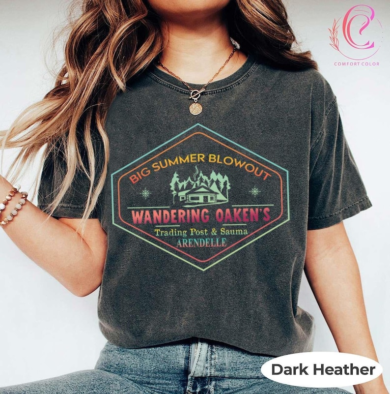 May include: Dark heather Comfort Colors t-shirt with a colorful graphic. The graphic reads "Big Summer Blowout" above "Wandering Oaken's Trading Post & Sauma Arendelle" in a hexagon shape.