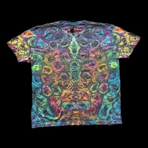 May include: A short-sleeved V-neck t-shirt with a vibrant tie-dye pattern. The shirt features a kaleidoscope of colors, including blue, purple, yellow, and green, creating a psychedelic effect. The fabric appears soft and comfortable.