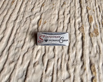 Statesman Insurance Group Lapel Hat Brooch Pin Advertising Pin