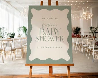 May include: A welcome sign for a baby shower with a sage green border and white text. The sign reads "Welcome to Brittany's Baby Shower 11 November 2020".