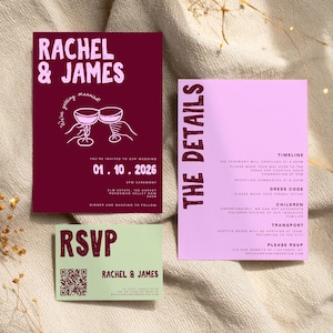 May include: A set of wedding stationery featuring a burgundy invitation with the names "Rachel & James" and event details, a pink details card, and a green RSVP card. The design includes illustrations of champagne glasses and a QR code.