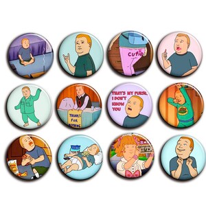 May include: A collection of twelve circular pin badges, each displaying a cartoon illustration of a young boy in different scenes. The badges are in various colours, including blue, green, and pink, and have a shiny surface.