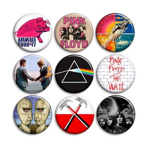 May include: A collection of nine circular pin-back buttons featuring various Pink Floyd album art and imagery, including the Animals pig, the prism from Dark Side of the Moon, The Wall brick design, and band portraits in vibrant colors.
