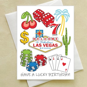 May include: A white greeting card with a Las Vegas theme. The card features illustrations of cherries, dice, a palm tree, a lucky number seven, a cactus, poker chips, playing cards, and the text "WELCOME TO FABULOUS LAS VEGAS NEVADA" and "HAVE A LUCKY BIRTHDAY!".