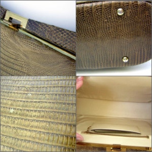 May include: A brown snakeskin clutch purse with a gold clasp and a white satin lining. The purse has a zippered pocket inside.