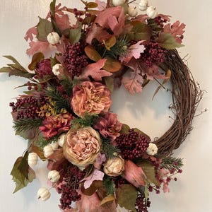Fall faux floral grapevine wreath with berries and pumpkins