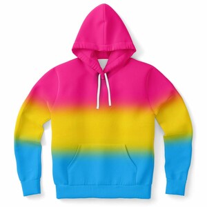 Könnte beinhalten: Ein Kapuzenpullover mit einem Farbverlauf in Pink, Gelb und Blau. Der Hoodie hat eine Vordertasche, einen Kordelzug und lange Ärmel. Das Farbschema wechselt von Pink an der Kapuze zu Gelb und dann zu Blau am unteren Rand.