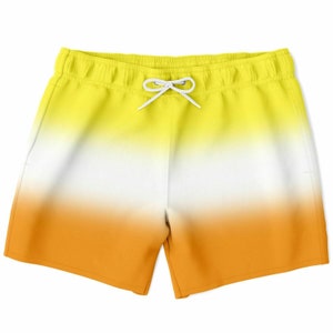 May include: Yellow, white, and orange ombre swim trunks with a white drawstring.