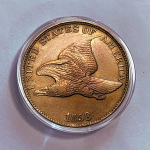 Moneta pamiątkowa Flying Eagle One Cent z 1858 r., numizmatyka amerykańska