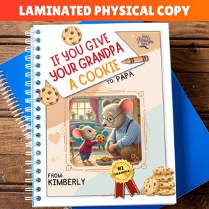 May include: A laminated physical copy of a children's book with a spiral binding. The cover features an illustration of two mice, one giving the other a cookie. Text includes "If You Give Your Grandpa A Cookie" and "To: Papa."