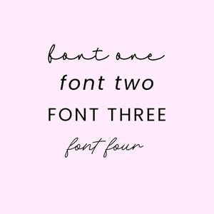 May include: A light pink background with the words "font one", "font two", "FONT THREE", and "font four" in black. The fonts vary in style, with "font one", "font two", and "font four" in a cursive script and "FONT THREE" in a bold, sans-serif font.