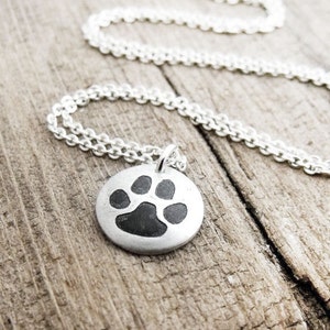 Tiny cat paw print necklace in silver, cat memorial jewelry