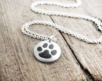 Tiny cat paw print necklace in silver, cat memorial jewelry