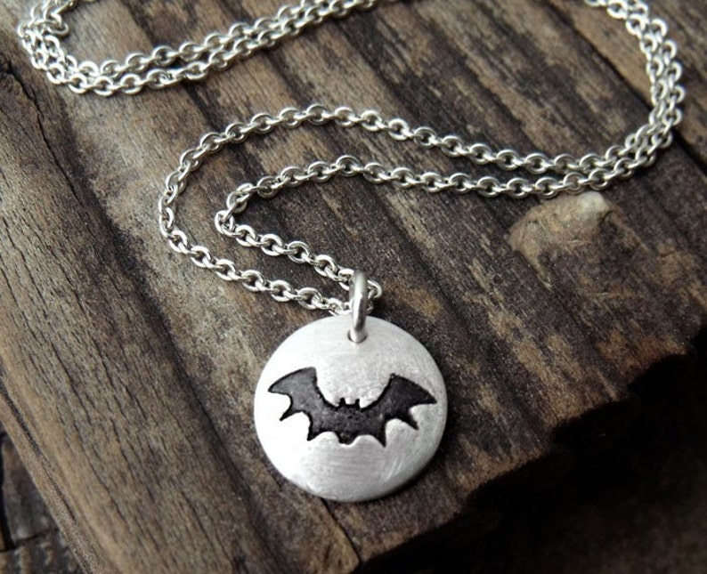 Tiny bat necklace in silver