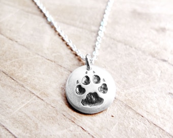Tiny dog paw print necklace in silver, pet parent gift