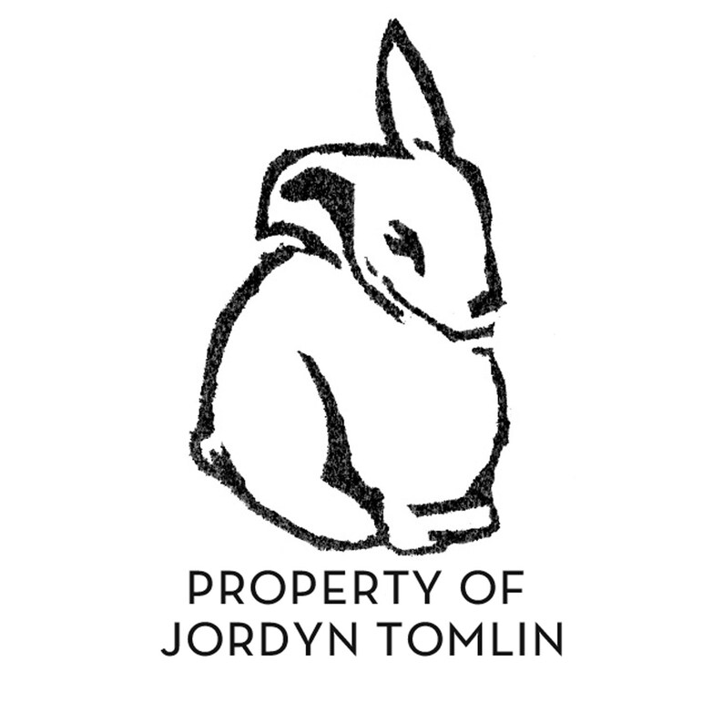 May include: Black and white line drawing of a rabbit sitting with the text "PROPERTY OF JORDYN TOMLIN" below.