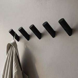 Gancho de pared moderno minimalista, personalizado, estilo único, negro mate, diseño de tornillo redondo, perchero minimalista, perchero para entrada y baño.