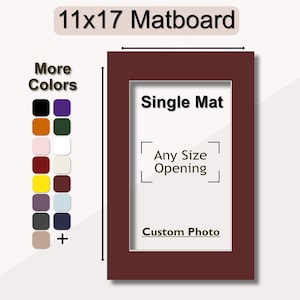 May include: A 11x17 inch matboard with a single mat opening. The matboard is a deep burgundy color. The mat opening is labeled "Any Size Opening" and "Custom Photo". The matboard is available in a variety of colors.