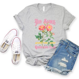 a t - shirt with a flower and a pair of jeans