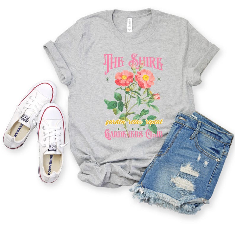 a t - shirt with a flower and a pair of jeans