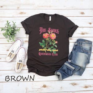 a t - shirt with a picture of a flower on it