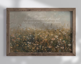 May include: A framed print with a painting of a field of wildflowers. The print features the text "Isaiah 40:8 The grass withers and the flowers fall, but the word of our God endures forever."